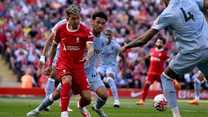 Em Anfield, a briga pela liderança da Premier League esquenta! O Liverpool busca ampliar sua vantagem, mas o Aston Villa promete resistência. Quem leva a melhor nesse duelo de gigantes? Imagem: Liverpool FC via Getty Images